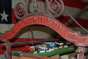 W.J. Robinson Sign over historic miniature model cars