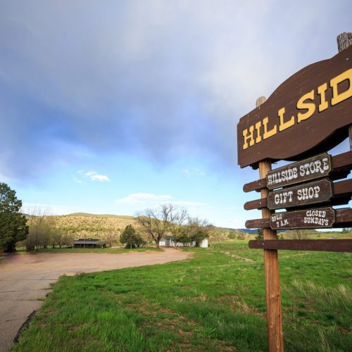 Hillside Sign Post with store and gift shop in background
