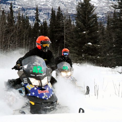Snowmobile Riders snowmobiling in the Wet Mountain Valley